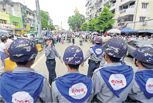  ?? EPA ?? Myanmar riot police block the road during a protest in downtown Yangon, Myanmar, on Tuesday.