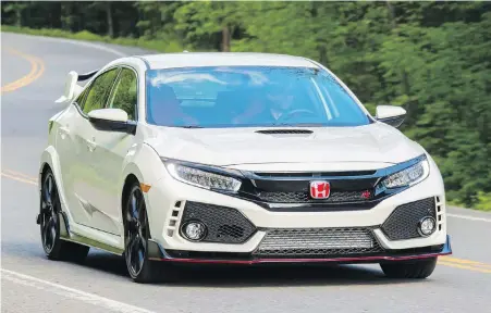  ?? HONDA ?? With scoops, ducts and spoilers aplenty — and a whale of a tail — you won’t mistake the 2017 Type R for any other Honda Civic.