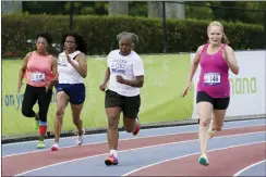  ?? MARTA LAVANDIER — THE ASSOCIATED PRESS ?? An over 60 years and older group of women run a 200-meter race during the National Senior Games, May 16, in Miramar,Fla.