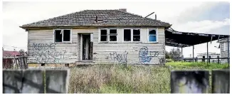  ??  ?? Derelict houses are not an uncommon sight in Huntly west.