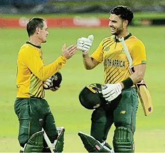  ?? /Isuru Sameera /Gallo Images ?? That winning feeling:
SA openers Quinton de Kock, left, and Reeza Hendricks celebrate the Proteas’ 10-wicket win over Sri Lanka.