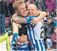  ??  ?? Ross Millen celebrates his goal with Chris Burke