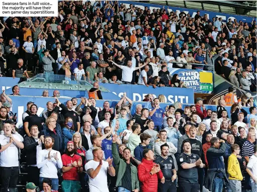  ?? ?? Swansea fans in fulll voice... the majority will have their own game-day superstiti­ons