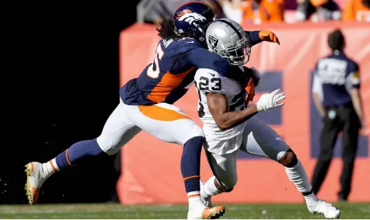  ?? David Zalubowski, The Associated Press ?? Denver linebacker Alexander Johnson tackles Las Vegas running back Kenyan Drake (23) Sunday.