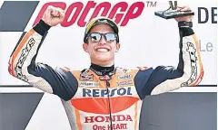  ??  ?? Marc Marquez celebrates on the podium after the MotoGP race of the French motorcycli­ng Grand Prix in Le Mans, northweste­rn France. — AFP photo