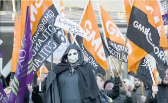  ??  ?? Fighters GMB members take the workers’ frontline