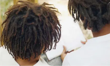  ??  ?? ‘They put my hands around my back, put their hands over my mouth and started to cut my hair,’ said Amari Allen. Photograph: Karin Dreyer/Getty Images/Tetra images RF