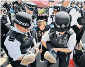  ??  ?? ‘Playing dead’ means that four police officers are needed to remove each protester