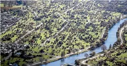  ??  ?? The Avon River and Dallington suburb in the city’s residentia­l red zone.