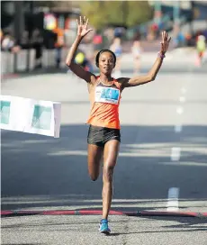  ?? ARLEN REDEKOP/PNG STAFF PHOTO ?? Monicah Ngige was the top female runner in The Vancouver Sun Run in a time of 32 minutes 23 seconds.