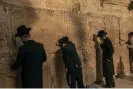  ?? ?? Ultra-Orthodox Jews pray at the men’s section of the Western Wall, in the Old City of Jerusalem. Photograph: Alessio Mamo/The Guardian