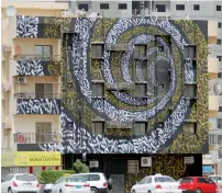  ??  ?? This stunning spiral mural on Leewara building in Al Bustan area actually depicts words from one of Sheikh Mohammed’s poems.