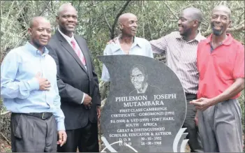  ??  ?? REVELATION: Professor Arthur Mutambara, second from left, stands with family members at his father Philemon Joseph’s tombstone unveiling ceremony.