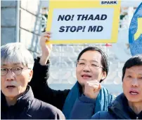  ?? AP ?? Protesters shout slogans during a rally to oppose the plan to deploy the Terminal High-Altitude Area Defence system in front of the Defence Ministry in Seoul, South Korea, on Tuesday.—