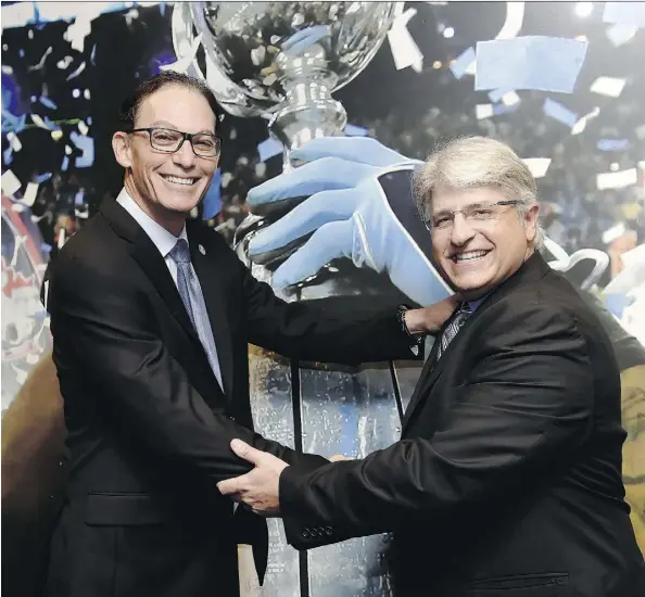  ?? FRANK GUNN/THE CANADIAN PRESS ?? Marc Trestman, left, and Jim Popp are introduced as the head coach and general manager, respective­ly, of the Toronto Argonauts at a news conference in Toronto on Tuesday. Popp and Trestman previously worked together as GM and coach of the Montreal...