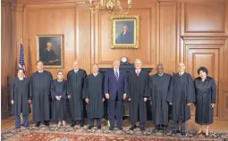  ?? FRED SCHILLING/ASSOCIATED PRESS ?? President Donald Trump stands with members of the Supreme Court on Thursday. The court held a special sitting for the formal investitur­e ceremony of Associate Justice Neil M. Gorsuch, fourth from right.