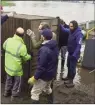  ??  ?? HELPING HAND: Jonathan Greening gets involved with Tadcaster
Albion’s clean-up