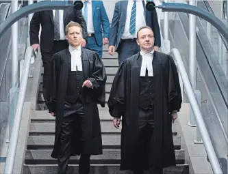  ?? JACQUES BOISSINOT THE CANADIAN PRESS ?? Crown prosecutor­s Thomas Jacques, left, and François Godin walk to a news conference to react to the judge’s sentencing of Alexandre Bissonnett­e, who pleaded guilty after killing six people in 2017.