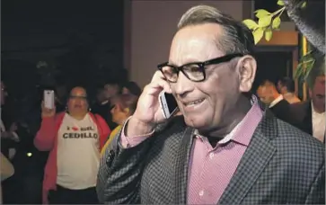  ?? Glenn Koenig Los Angeles Times ?? L.A. CITY Councilman Gil Cedillo takes a congratula­tory call while celebratin­g Tuesday. A committee led by the Los Angeles County Federation of Labor spent about $300,000 helping Cedillo’s District 1 campaign.