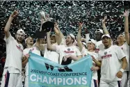  ?? JOHN LOCHER — THE ASSOCIATED PRESS ?? Gonzaga players celebrate after defeating Saint Mary’s in the final of the West Coast Conference men’s tournament in Las Vegas on March 10.