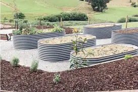  ??  ?? The fully landscaped community garden is an exciting new addition at Tarago Gardens, Neerim South.