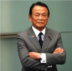  ??  ?? Aso looks on during Prime Minister Shinzo Abe and US Vice President Mike Pence’s joint news announceme­nt in Abe’s official residence in Tokyo, Japan. — Reuters photo