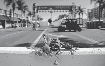  ?? ERIC THAYER/ GETTY IMAGES ?? Flowers are placed Sunday, the morning after a shooting killed 10 in Monterey Park, Calif.