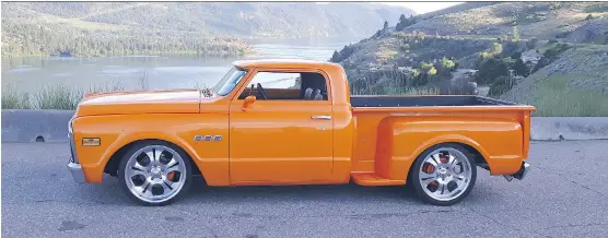  ?? PHOTOS: RON TKACHUK ?? Ron Tkachuk’s 1971 GMC radical custom pickup catches plenty of eyes with its dramatic lines and that tango pearl orange paint job.