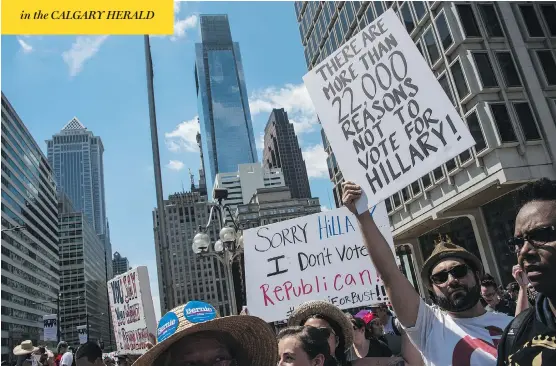  ?? NICHOLAS KAMM / AFP / GETTY IMAGES ?? Ahead of the Democratic National Convention in Philadelph­ia, Bernie Sanders supporters hold protests against Hillary Clinton, the party’s nominee for president. The Clinton campaign’s effort to portray the Democrats in a different light from the...