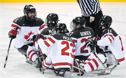  ?? INTERNATIO­NAL PARALYMPIC COMMITTEE-SEOKYONG LEE/THE CANADIAN PRESS ?? Canada’s para hockey team celebrates a goal on their way to defeating the United States 4-1 on April 20 to capture a gold medal at the world para hockey championsh­ip in Gangenung, South Korea.