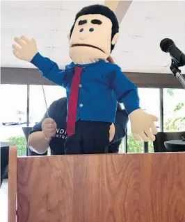 ?? COURTESY OF JOAN CAVE ?? Indivisibl­e Central Florida, a liberal organizati­on, uses the puppet “Lil Marco” to signify U.S. Sen. Marco Rubio’s absence from its town-hall meeting in Maitland on Saturday.