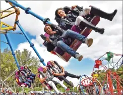  ?? Picture: Jason Boud/ANA ?? FLYING: Festival-goers enjoy rides at the Mitchells Plain fun family event.