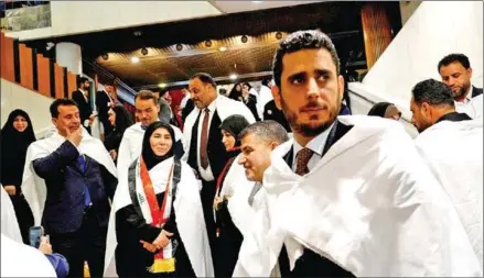  ?? AFP ?? Supporters of Iraqi Shiite cleric Muqtada al-Sadr gather inside the Iraqi parliament in the capital Baghdad, ahead of the country's presidenti­al election, on Saturday.