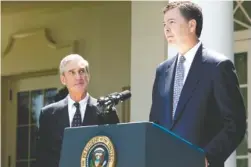  ?? NEW YORK TIMES FILE PHOTO ?? Then-FBI Director Robert Mueller, left, looks on as James Comey speaks at a news conference in the Rose Garden of the White House in June 2013.