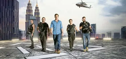  ?? — Handout ?? bamber (centre) is the latest addition to Season Six of Strike Back which was shot in Malaysia.