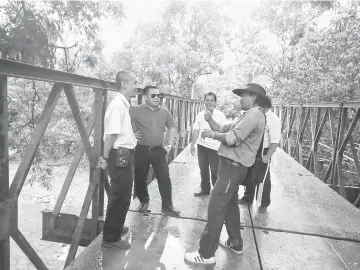  ??  ?? Miro (second left) talks to villagers during his site visit recently.