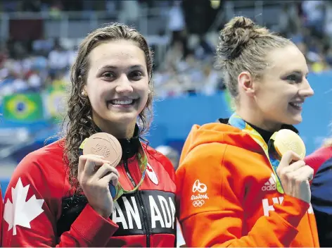  ?? JEAN LEVAC ?? Hungarian swimmer Katinka Hosszu, right, seen on the podium with Canadian Kylie Masse at the Rio Olympics, is spearheadi­ng an effort to form a profession­al swimmers’ union to garner strength in their dealings with the sport’s troubled internatio­nal...