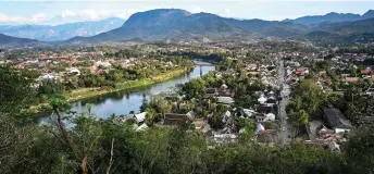  ?? — AFP photos ?? A general view of the Mekong river in Luang Prabang. A short boat ride upstream from the ancient Laotian royal capital of Luang Prabang, a massive dam is under constructi­on that critics say threatens the riverside town’s allure and heritage status.