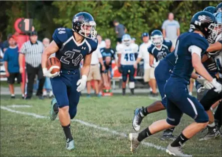  ?? SUBMITTED PHOTO - DENNIS KRUMANOCKE­R ?? Kutztown running back Logan Bachman looks for a running lane during Friday’s game against Shenandoah Valley.