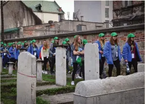  ?? (Yossi Zeliger/Flash90) ?? PARTICIPAN­TS IN the March of the Living walk past a Jewish cemetery in Krakow, Poland, yesterday.