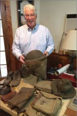  ?? PAUL POST PHOTO ?? Charles Wheeler Jr., of Saratoga Springs, holds the helmet his grandfathe­r, Thomas B. Wheeler, wore during World War I.