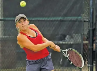  ?? STAFF PHOTO BY DOUG STRICKLAND ?? Baylor’s Drew Hawkins returns the ball during her TSSAA Division II-AA singles final against teammate Landie McBrayer on Friday in Murfreesbo­ro. Hawkins won her third state title in a row.