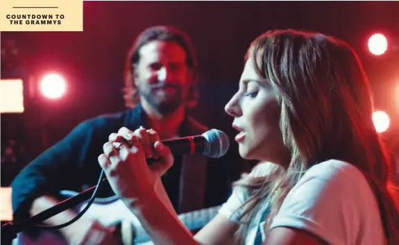  ??  ?? Bradley Cooper and Lady Gaga perform “Shallow” in ”A Star Is Born.”