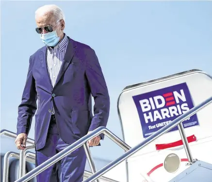  ?? PHOTO: REUTERS ?? Frontrunne­r: Joe Biden arrives at Phoenix Sky Harbour Internatio­nal Airport in Phoenix, Arizona, for a campaign event yesterday.