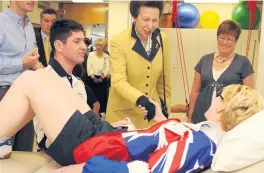  ??  ?? Royal visit: Janet meets Princess Anne at the UUJ Sports Centre in 2004 and (right) Janet and Paul’s wedding