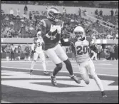  ?? Associated Press ?? Rams wide receiver Van Jefferson catches a touchdown past Arizona Cardinals cornerback Marco Wilson (20) on Sunday in Inglewood. The Rams play the Saints on Sunday.