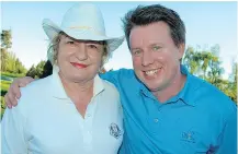  ??  ?? Tournament co-chair Renate Mueller and First Tee program manager Christophe Collins helped raise $40,000 so underserve­d kids can learn to play golf.