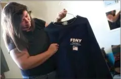  ?? RECORDER FILE PHOTO ?? Roslyn Brennan shows the FDNY sweatshirt that was given to her.