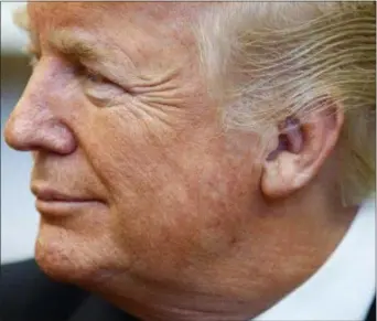  ?? EVAN VUCCI — THE ASSOCIATED PRESS ?? President Donald Trump listens to Israeli Prime Minister Benjamin Netanyahu during a meeting in the Oval Office of the White House, Monday in Washington.