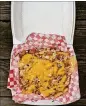  ?? WENDELL BROCK FOR THE ATLANTA JOURNAL-CONSTITUTI­ON ?? Big Dave’s Cheesestea­ks offers loaded fries with cheesestea­k fillings. This order of Philly fries is topped with chopped fried chicken and cheese.